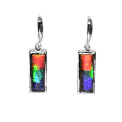 These ammolite earrings are rectangular shaped and are a mix of red, yellow, green, blue, and purple.