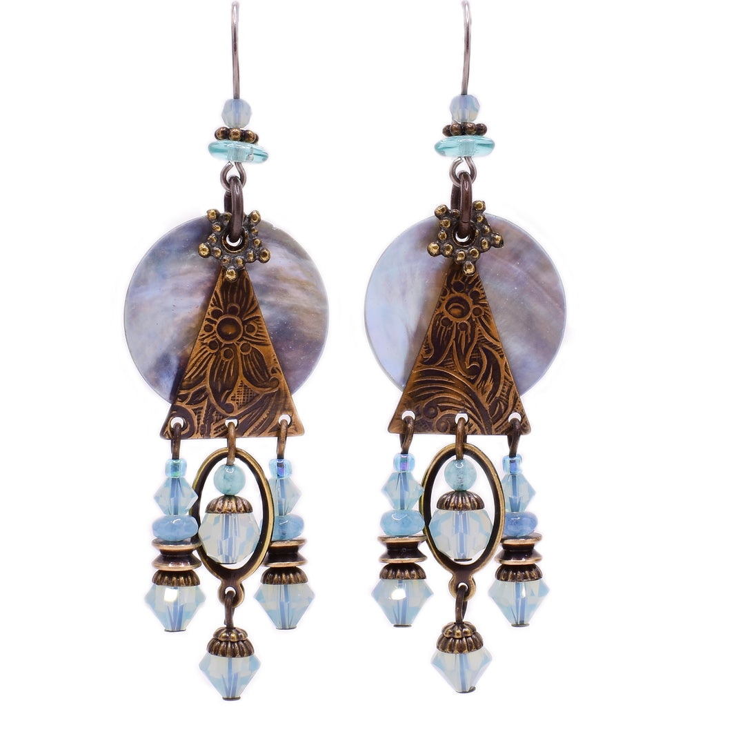 These dangle earrings feature a circular, light blue shell with a triangular, brass accent in front of it. Attached to the brass is three strands featuring multiple light blue gemstones and glass beads and brass accents.