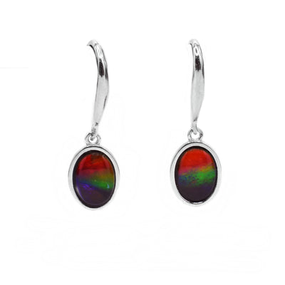 Each ammolite earring is oval shaped and is a mix of red, green, blue, and purple.
