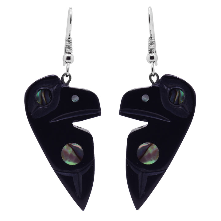 These argillite stone and abalone earrings have chunky argillite hangs that have been carved to depict the Raven. The Ravens head is by the hangs and is has a wing depicted below it. There is abalone set by the wing and in the eye. 