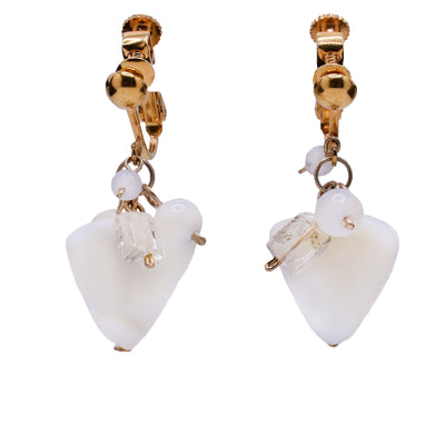 These clip earrings feature a triangular mother of pearl as the centerpiece with a cluster of white and clear gemstones on top. Above is the brass earring clip along with some brass accents.