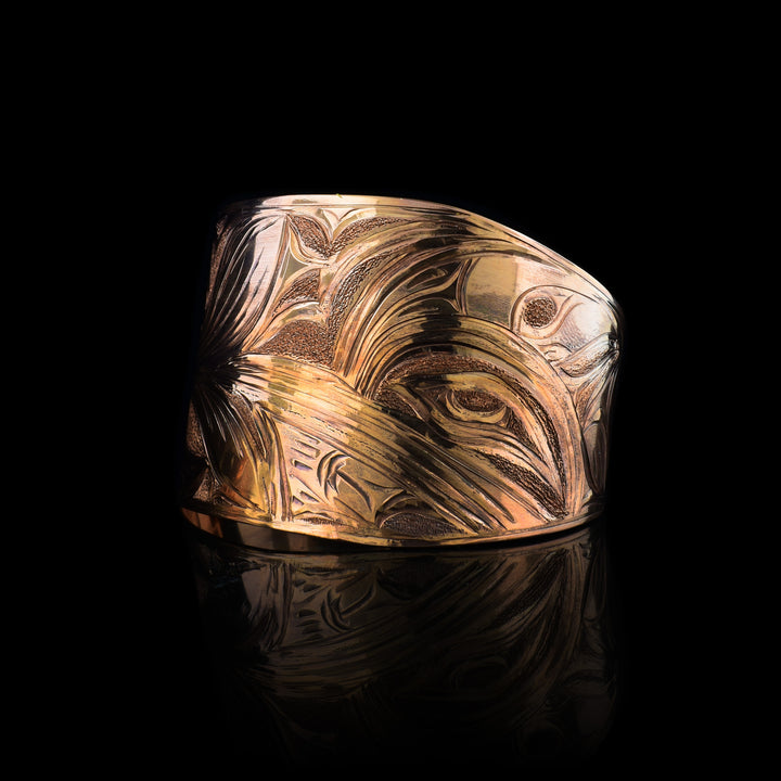 Hand-carved 2" Copper Hummingbird Tapered Cuff by Kwakwaka'wakw artist Cristiano Bruno. A bold Northwest Coast statement bracelet featuring traditional formline art.