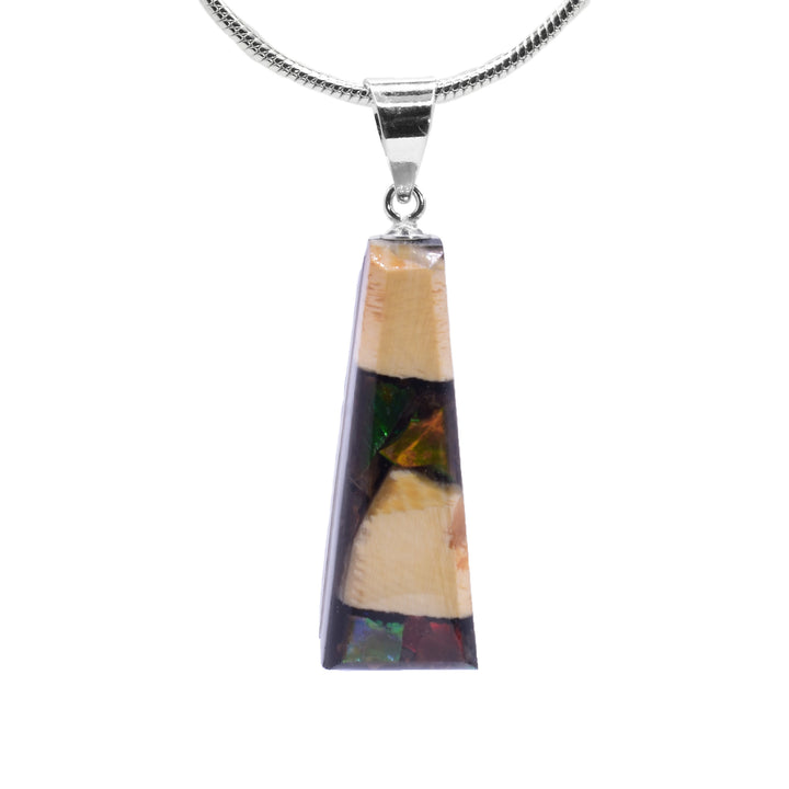 This ammolite pendant is made from fossilized mammoth ivory and ammolite gemstones. Chunks of ivory and ammolite are set in resin and make a short, tapered shape.