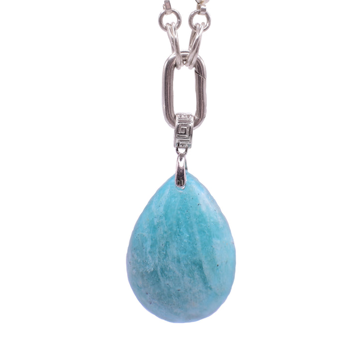 This amazonite pendant is large and teardrop shaped. It hangs from a decorative, wide hoop connected to a chain link.