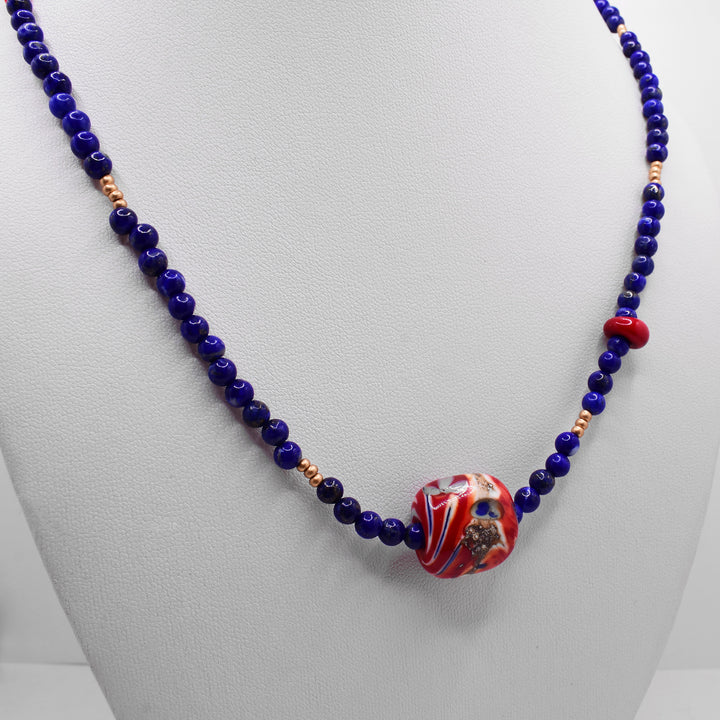 Secondary photo of the lapis necklace shows the necklace on a white necklace display.