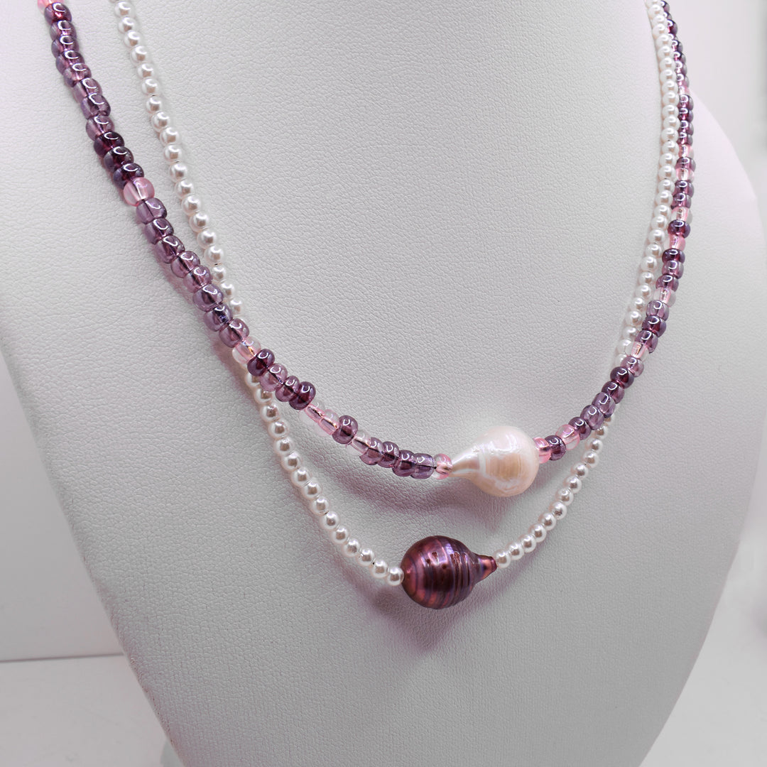 Second photo of the pearl necklace shows the necklace on a white necklace display.