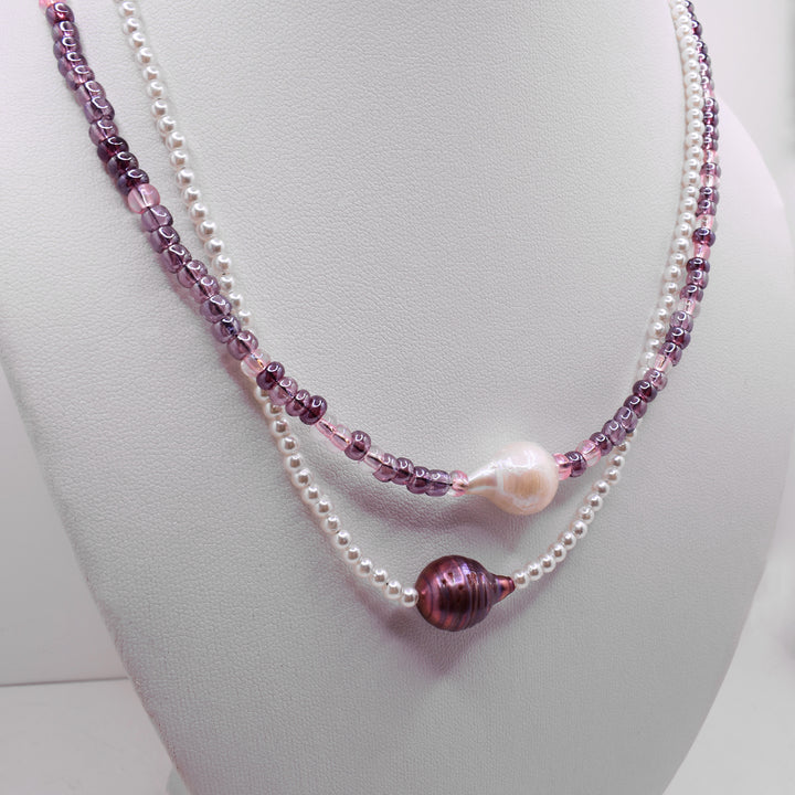 Second photo of the pearl necklace shows the necklace on a white necklace display.