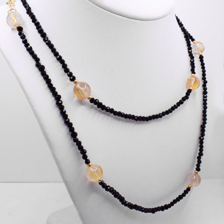 Secondary photo shows this necklace wrapped twice around a white necklace display.