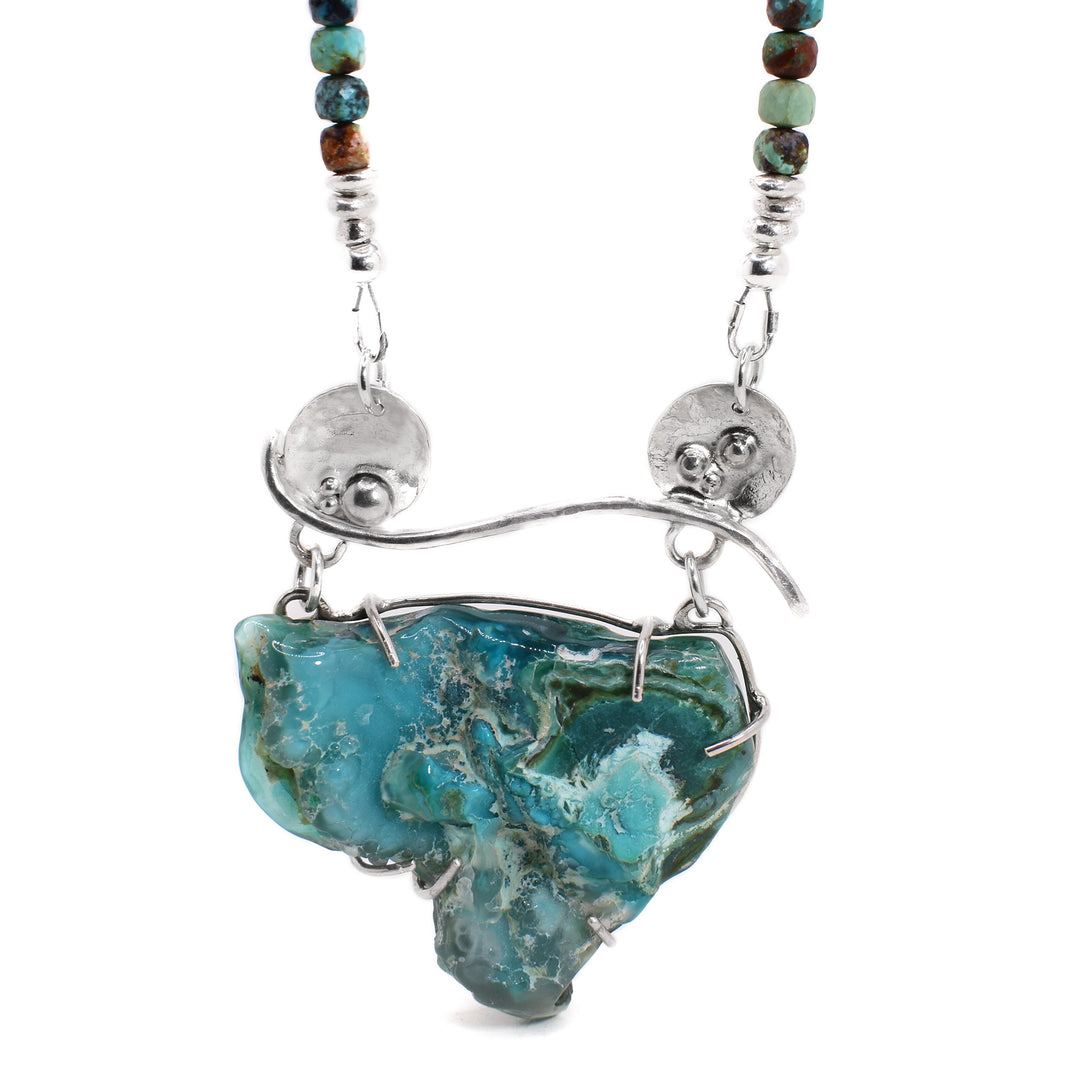 Secondary photo shows the necklace hanging from its chain.