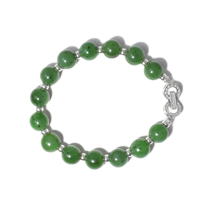 This jade bracelet is made up of small jade beads with sterling silver accents in between and a large clasp.
