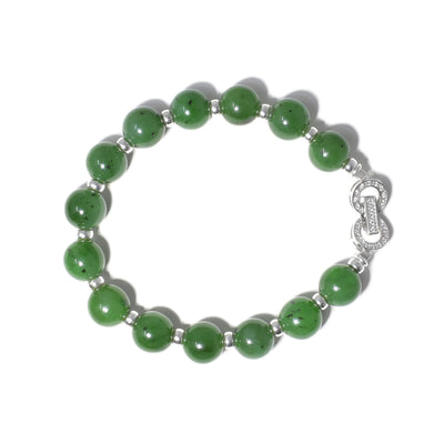 This jade bracelet is made up of small jade beads with sterling silver accents in between and a large clasp.