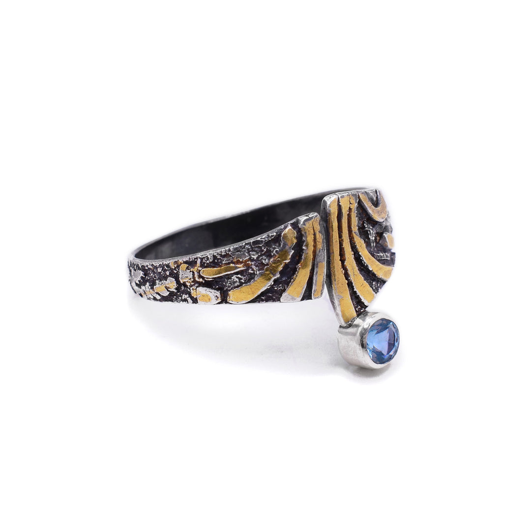 Left side photo of the ring shows more detail of the side which has gold accents in addition to oxidized sterling silver throughout.