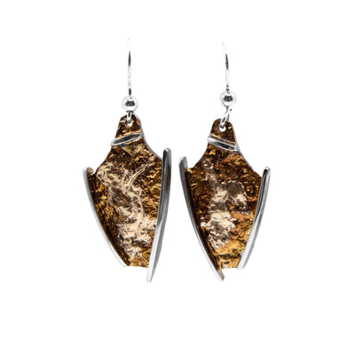 These oxidized silver earrings are vase-shaped and are orange, light-brown, and brown in colour.