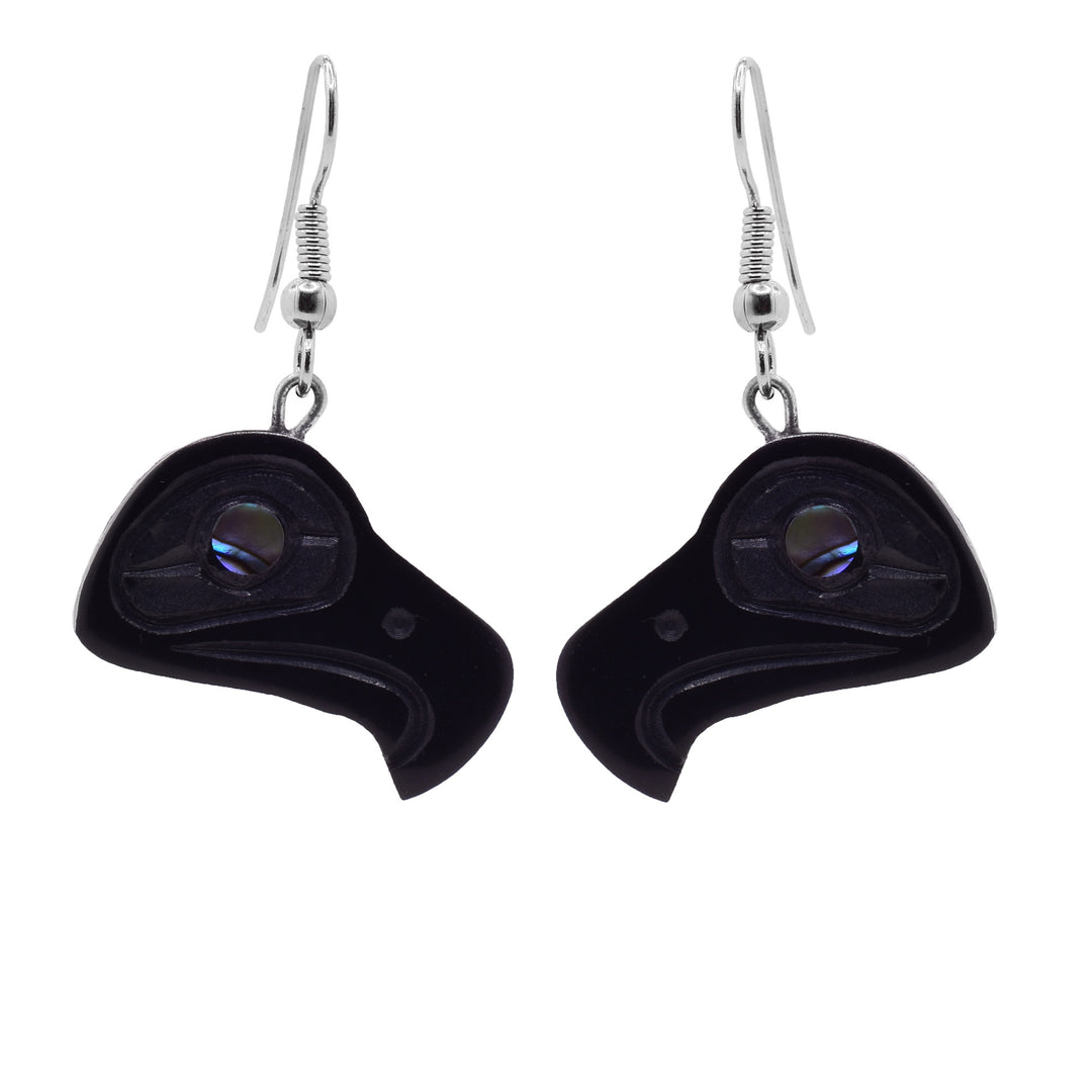 These eagle abalone earrings have argillite hangs that are shaped like the head of an eagle. The hangs have been carved and have abalone shell gems set into the eyes.