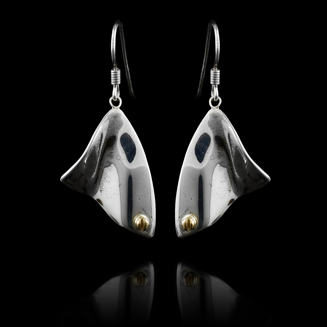 These abstract dangle earrings has triangle shaped hangs made from sterling silver. The hangs are wavy and have 14K gold studs in the bottom corner of the hangs.