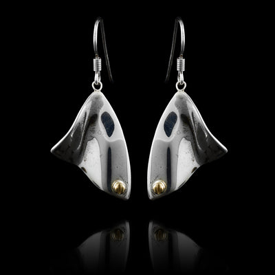 These abstract dangle earrings has triangle shaped hangs made from sterling silver. The hangs are wavy and have 14K gold studs in the bottom corner of the hangs.