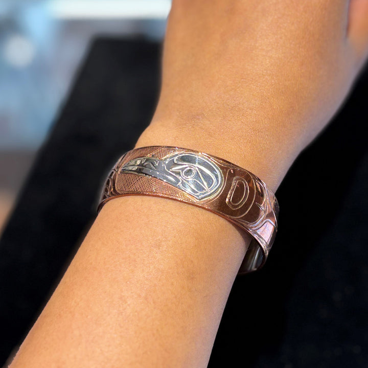 This photo shows the raven bracelet on a female wrist.