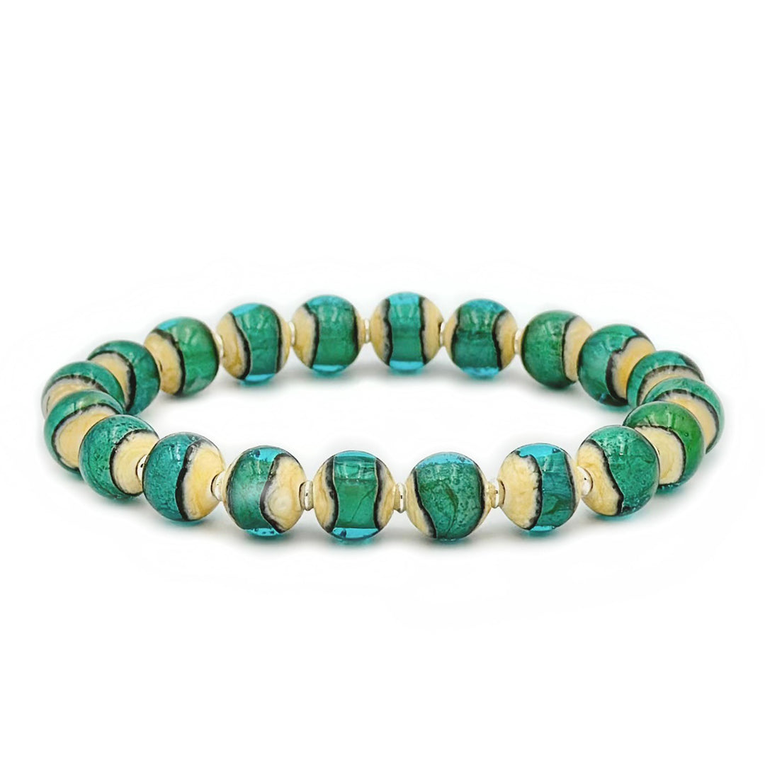 This glass bead bracelet has 20 beads connected on an elastic cord. Each bead is turquoise in colour in the center and beige on the outside.