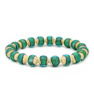This glass bead bracelet has 20 beads connected on an elastic cord. Each bead is turquoise in colour in the center and beige on the outside.