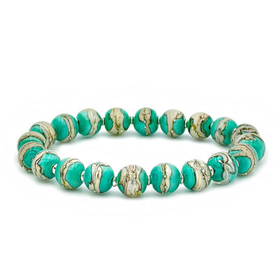 This glass bead bracelet has 20 beads connected on an elastic cord. The beads are turquoise and white in colour and have white dots on them.