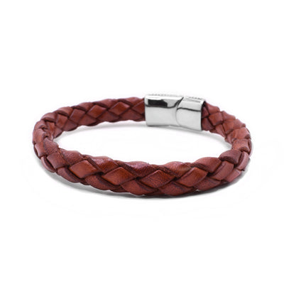 This leather bracelet has light brown leather woven together and connected by a magnetic sterling silver clasp.