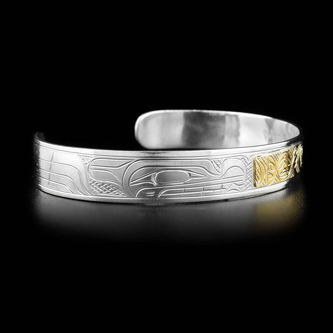 Left angle photo of the bracelet shows the head of the second wolf carved identically to the other.