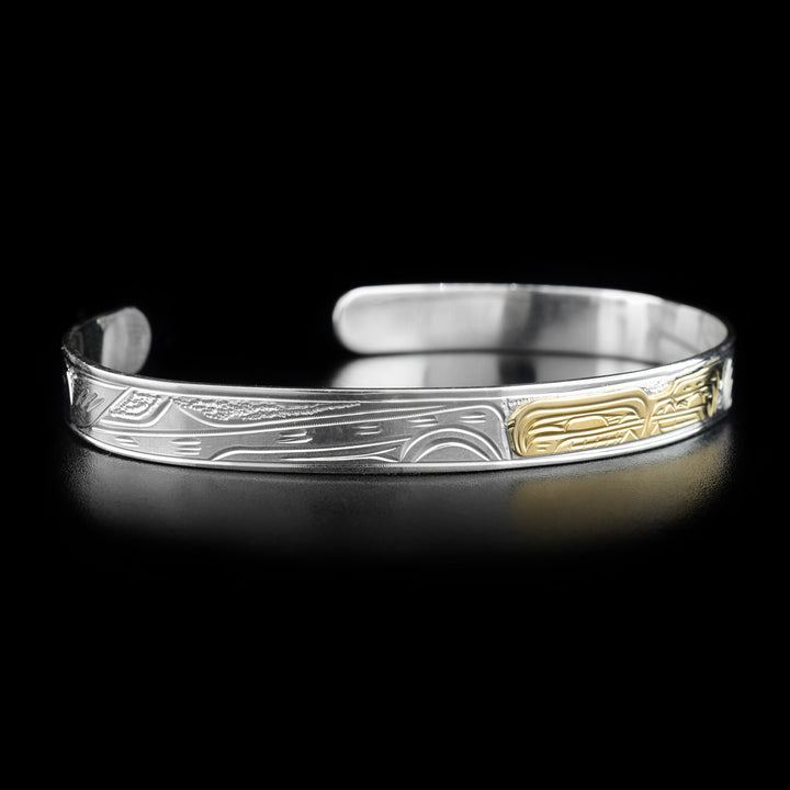 Left angle photo of the bracelet shows the long body and tail of the orca.