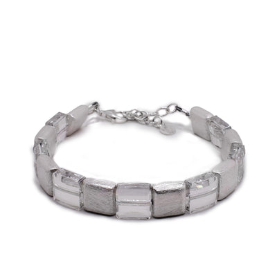 This bracelet has square beads that alternate between Swarovski crystal and bushed silver.
