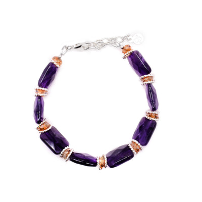 This sterling silver chain bracelet has rectangular amethyst and round Swarovski crystal beads. 