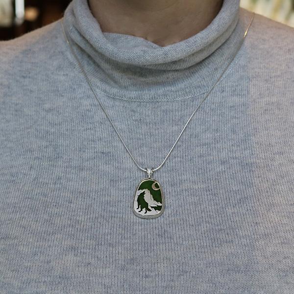 View of the jade necklace on a neck.