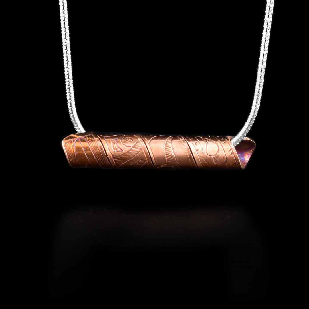 This spiral cylinder pendant is made from a single, copper band that has been twisted into a cylinder. There is depiction of the Hummingbird legend carved into the surface of the band so it appears on the outside of the cylinder. It is shown at a side profile with its head, eye and beak at one end and wing details behind it.