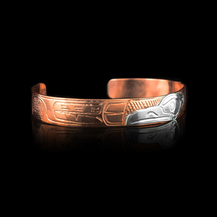 3/8" Copper Cuff With Sterling Silver Raven. The cuff is made out of copper and the Ravens head is made of sterling silver.