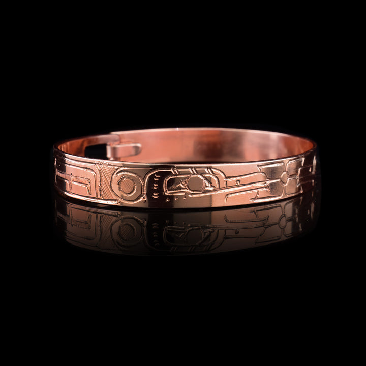 Hand-carved by Jefferey Pat, this copper clasp bracelet beautifully depicts the Hummingbird and Flowers. Authentically crafted Northwest Coast Indigenous jewelry.