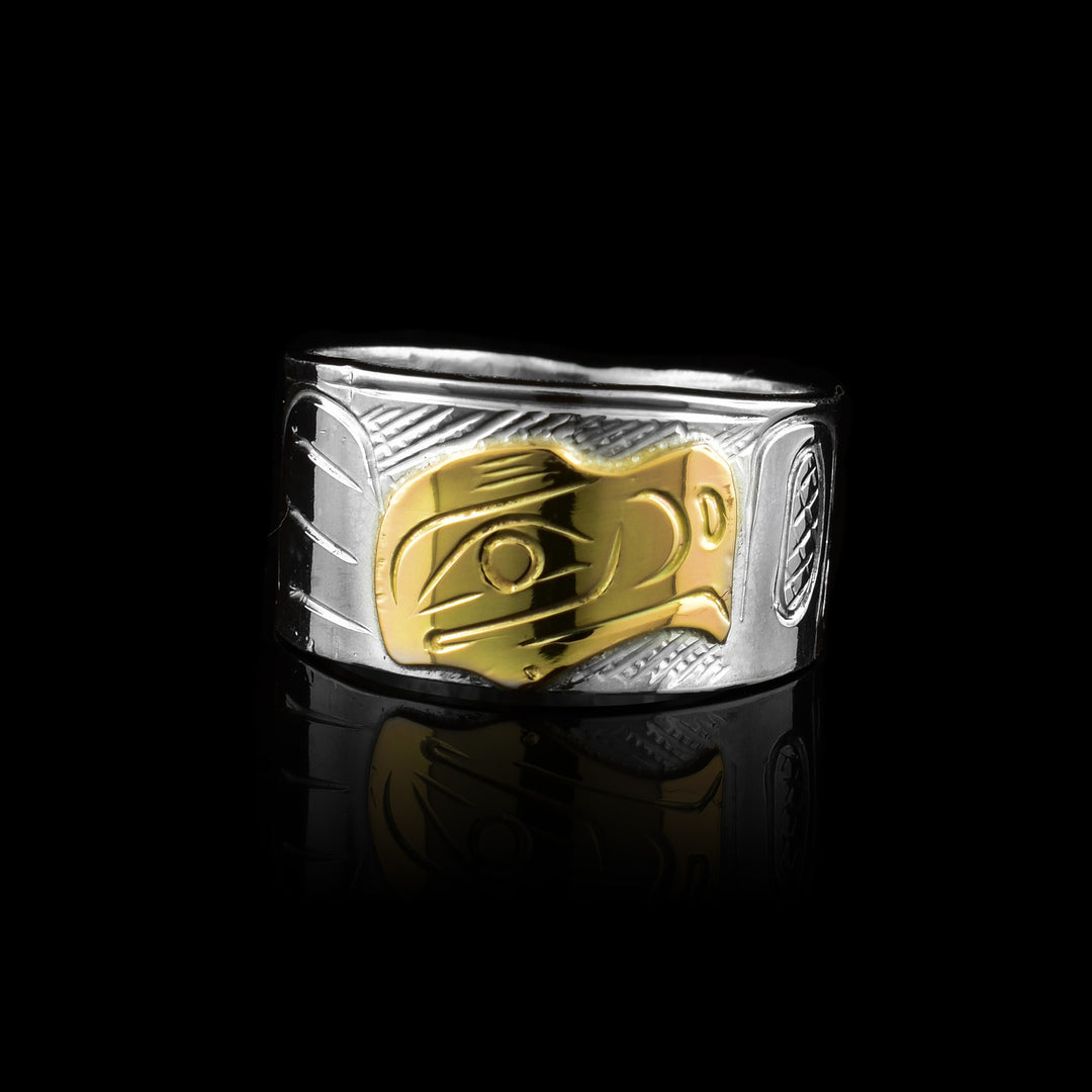 Graham Henry band made of sterling silver and 10k gold. Featuring a hand-carved Eagle legend in gold against a silver band, it showcases premium materials and traditional craftsmanship.
