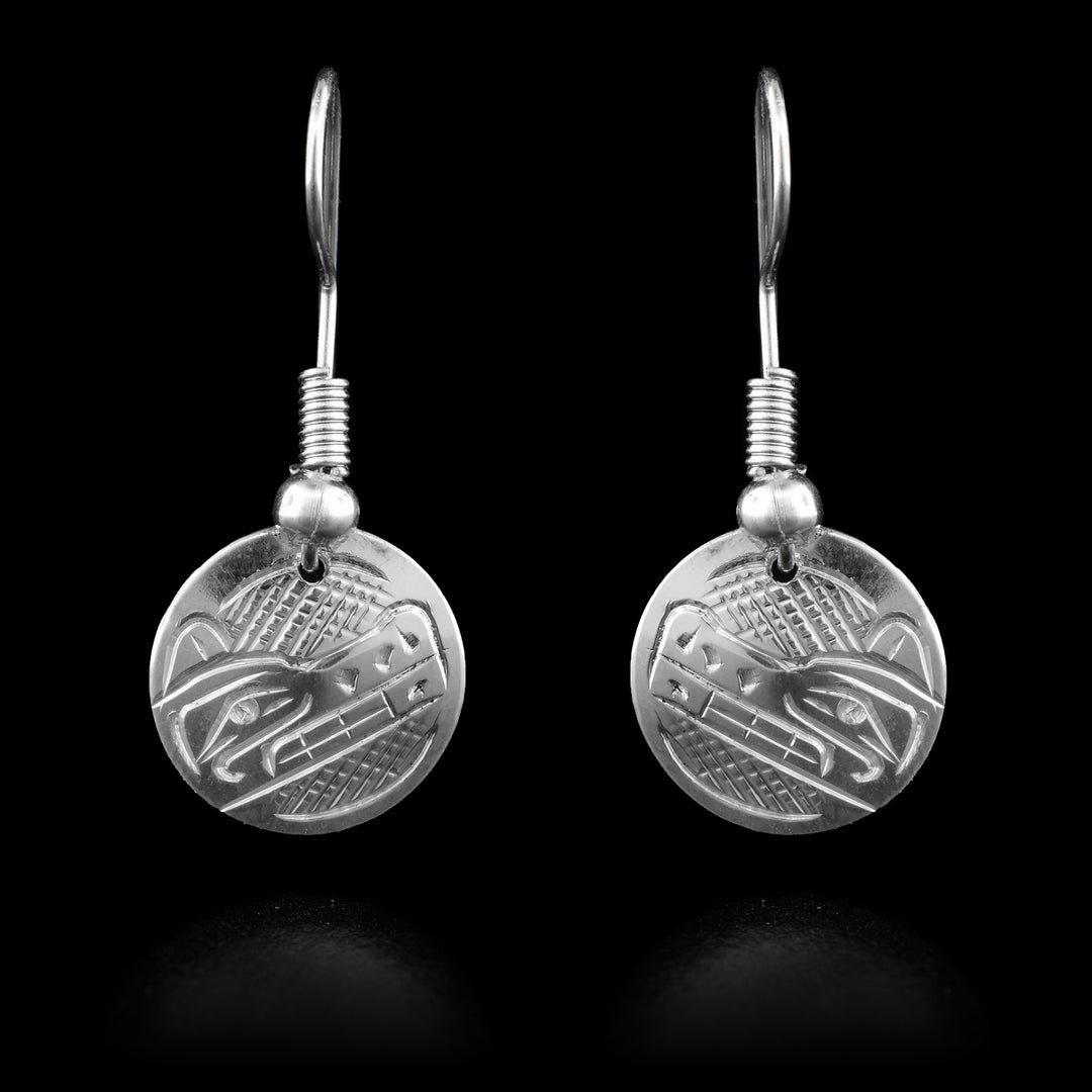 Hand carved circular sterling silver Wolf legend dangle earrings.