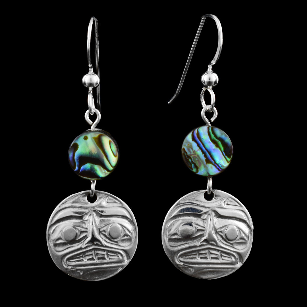 These circular dainty drop moon earrings feature the moon engraved in round sterling silver. On top of the earring is a circular abalone shell bead, with beautiful natural swirls of colourful blues, greens, and purples that shimmer when caught in the light. Finished with classic French hooks.