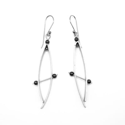 Abstract aluminum drop earrings with hematite beads and stainless steel hooks. By JR Franco.