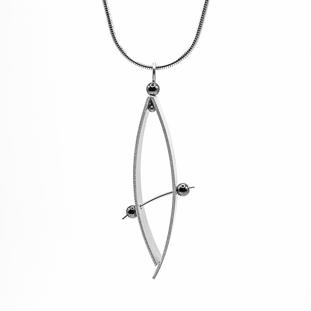 Long, abstract aluminum pendant with hematite beads. Stainless steel snake chain included. By JR Franco.