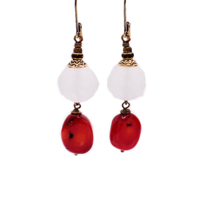 Brass dangle earrings featuring white handmade lampworked glass beads and coral beads.