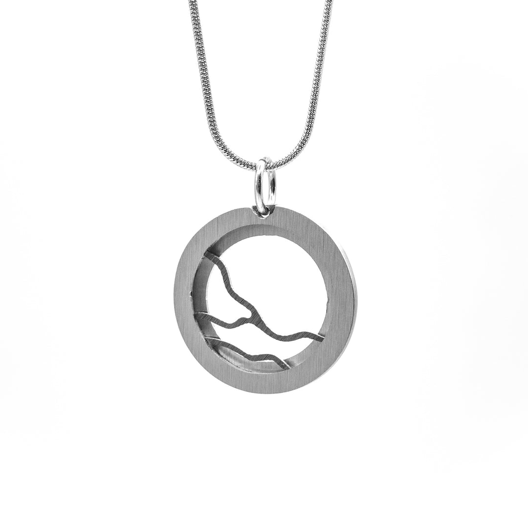 Brushed and anodized aluminum. Round, steel-coloured frame depicting horizontal grey lightning streaks going across.