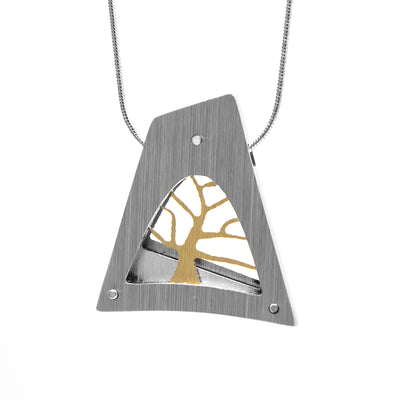 Large, triangular frame in silver, gold tree inside. Pendant is brushed and anodized aluminum. Minimalist design.