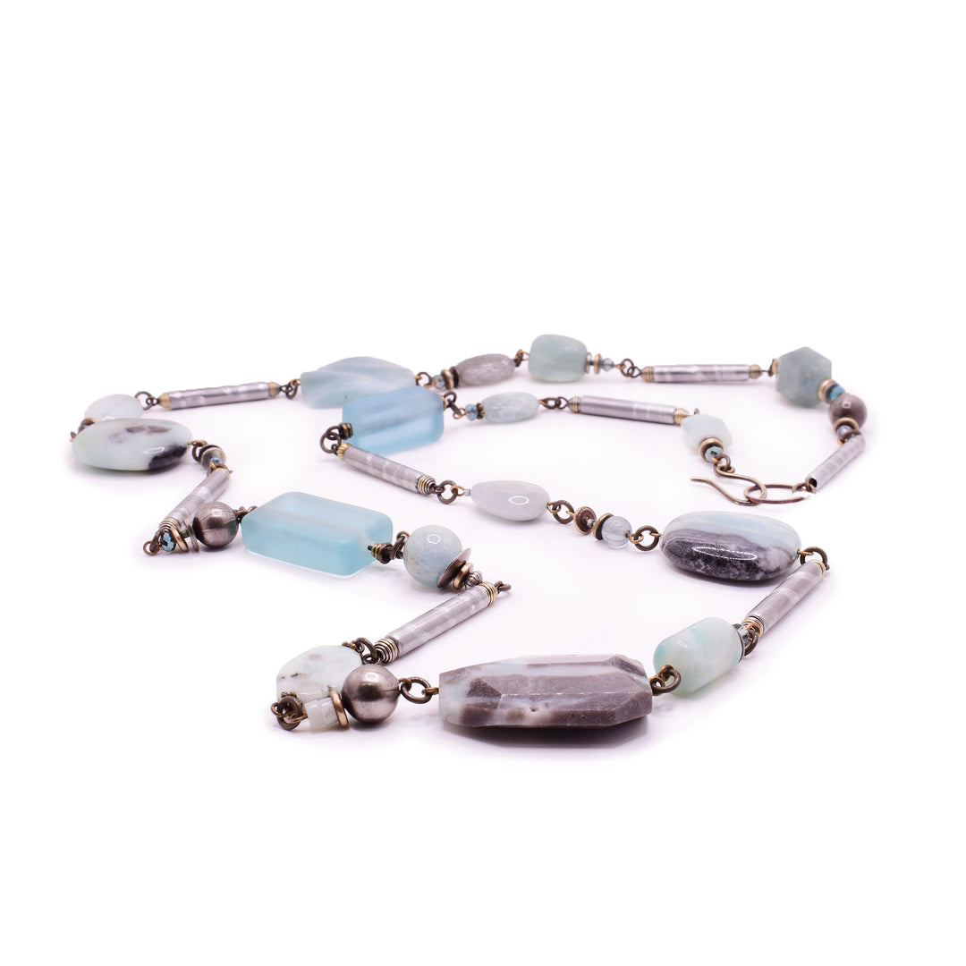 artisan necklace by Honica featuring amazonite, aquamarine, and Austrian crystals. Handcrafted with handworked brass and lampwork glass for a versatile, elegant look.