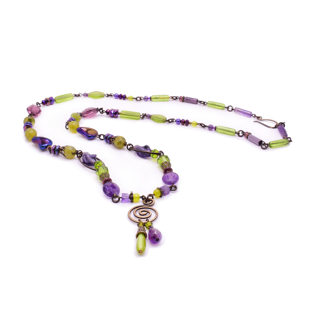 handcrafted necklace by Honica featuring serpentine jade, amethyst, peridot, and Austrian crystals. A stunning, nature-inspired artisan piece.