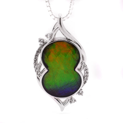 Sterling silver faceted ammolite pendant with white sapphires. By Enchanted Designs.