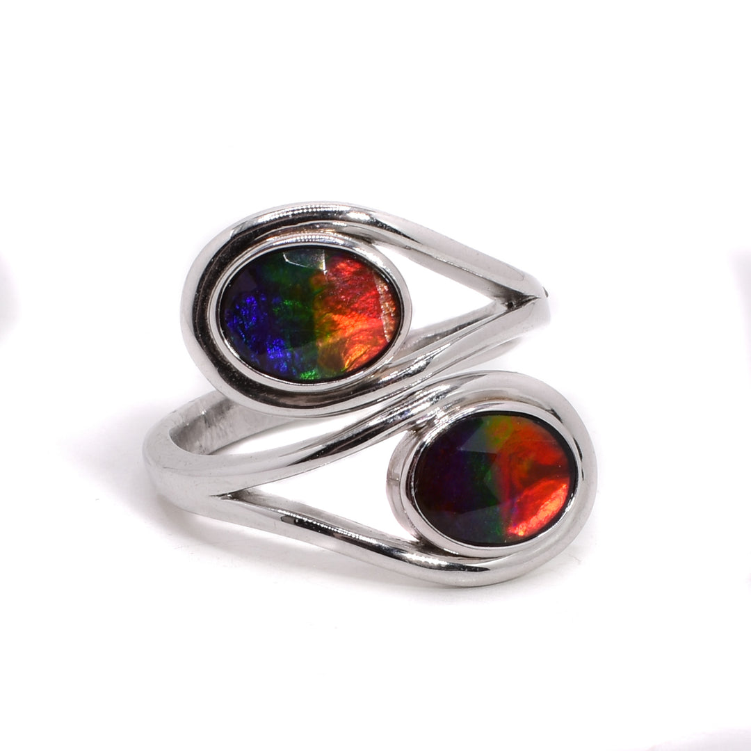 This wra around ammolite ring is made out of sterling silver and two oval ammolite stones.