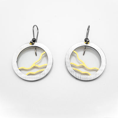 Each earring has a silver-coloured frame with horizontal yellow lightning streaks featured. Hook is stainless steel, design is brushed and anodized aluminum.