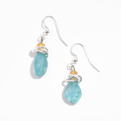 Sterling silver blue aquamarine earrings with interlocking hoops adornments and orange crystals.