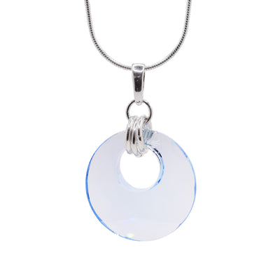 This Swarovski crystal pendant features a blue Swarovski crystal. The bail incorporates three silver rings.  