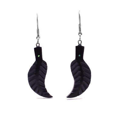 Hand-carved argillite feather dangle earrings, each with a small abalone circle near top of earring. Feathers pointing downwards. By Haida artist Amy Edgars.