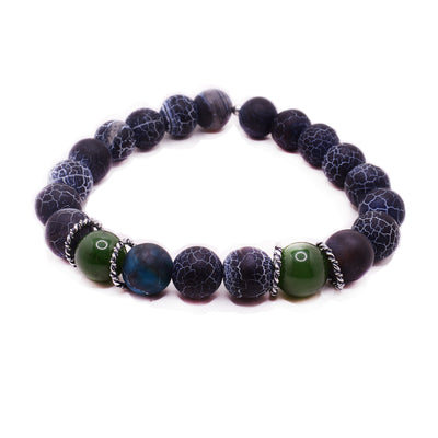 An elastic band bracelet that has agate and jade beads. There are two jade beads in the front, they have three agate beads between them. The rest of the beads around the bracelet are agate. 